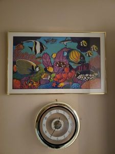 lot 254 image: Bulova Quartz Wall Clock and Fish Swimming in the Coral Framed Print