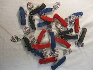 lot 23 image: Tube of About 20-Lock blade pocket knives with chains