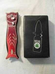 lot 29 image: 2-Knifes, 1-,Lighter Style-Spring Assisted Open-Lock Blade Pocket Knife,1-The Owl-Push button  Switch Blade, Knife, Model KK-513.