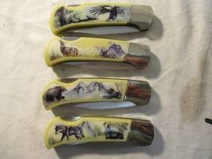 lot 34 image: 4- Wildlife Collection-Lock Blade Pocket Knifes. Wolves, Bear, Eagle, Dear- Scene
