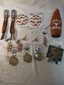 lot 72 image: LOT-UNIVERSITY OF TEXAS LONGHORNS Football Team -Support Buttons, Cozies, Magnets, Keychains, And Sunglass Straps.