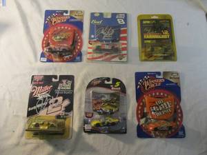 lot 98 image: 6- Vintage-Collectors- Signed Nascar Diecast Cars, All in Original Sealed Packages.