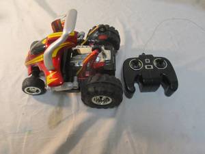 lot 99 image: MerchSource Remote Control Twist Car,49 MHz Yellow Black Red.