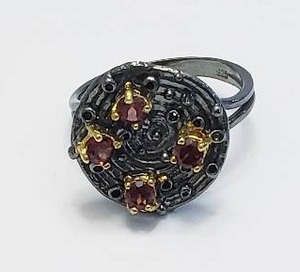 lot 5 image: Sterling Silver Ring with Garnets.  Stamped 925 - Size 7.5