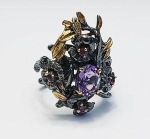 lot 8 image: Sterling Silver Ring with Amethyst and Garnets.  Stamped 925 - Size 6.5