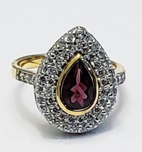 lot 9 image: Sterling Silver Ring with Center Garnet.  Stamped 925 - Size 7.5