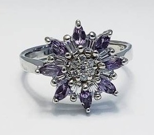 lot 12 image: Sterling Silver Ring with Amethyst Stones.  Stamped 925 - Size 8.5