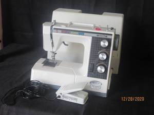 lot 121 image: WHITE ROTARY MODEL 2221 SEWING MACHINE IN CASE