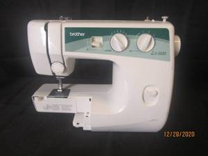 lot 134 image: BROTHER LS-2020  SEWING MACHINE POWERS ON -- POWER CORD NOT INCLUDED