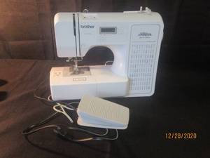 lot 140 image: BROTHER  PROJECT RUNWAY LIMITED EDITION COMPUTERIZED SEWING MODEL CE1100PRW