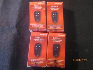 lot 103 image: 4 HONEYWELL FOUR BUTTON WIRELESS KEY TRANMITTER  MODEL 5834-4