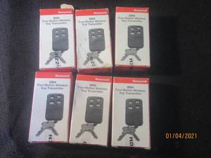lot 104 image: 6 HONEYWELL FOUR BUTTON WIRELESS KEY TRANMITTER  MODEL 5804
