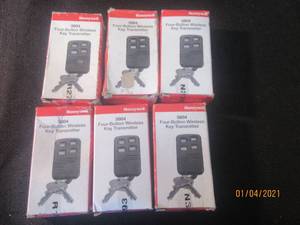 lot 105 image: 6 HONEYWELL FOUR BUTTON WIRELESS KEY TRANMITTER  MODEL 5804