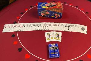 lot 84 image: Alutomatice Card Shuffler NIB and 1 deck of cards