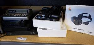 lot 22 image: Pasonomi virtual reality headset, NOAA weather alert, Magnovox Portable DVD Player, Sony CDDVD Player, GPX DVD Player, and Nissho Iwai Model PTV-050