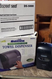 lot 84 image: Marathon Automatic Towel Dispenser, Kimberly-Clark Automatic Handsoap Dispenser, Toilet Seat Covers,  Wooden Toilet Paper Holder