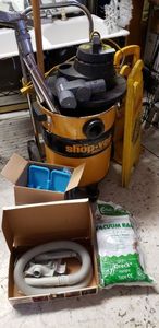 lot 81 image: Industrial WetDry ShopVac Model 464 on Cart, Caution Wet Floor Signs, Oreck Vacuum Bags Type CC, 2-Head Sweeper for Hard Surfaces