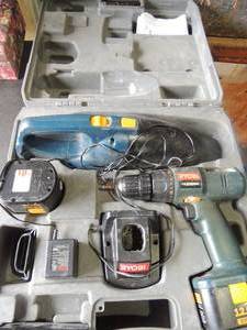 lot 142 image: Ryobi 12 volt drill,  charger and  vac in case