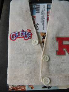 lot 147 image: GREASE DVD has cardigan sweater sleeve