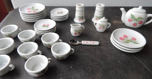 lot 157 image: Frenzy Toys 32 piece miniature tea set strawberry design  set for 8. plates saucers, cups, sugar creamer, tea pot spoons candle holder