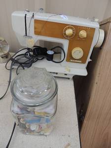lot 38 image: Nelco Golden Stitch Series Sewing Machine has cord and pedal includes jar of sewing notions