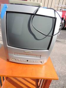 lot 39 image: 14Magnavox TV with built in  VHS player remote