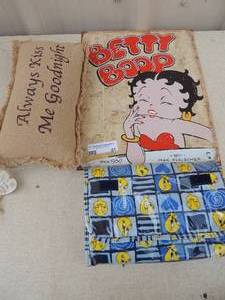 lot 41 image: Pillow, tweety bird travel case and Betty Boop metal wall hanging 16x12