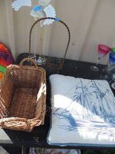 lot 52 image: Lot of dcor items- throw pillows, basket, metal wine holder DODO bird yard art