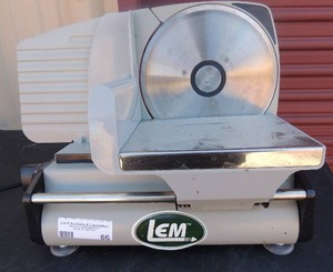 lot 86 image: LEM brand meat slicer 15 wide 11 tall