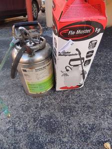 lot 95 image: 2 SPRAYERS - one metal,  one plastic with box