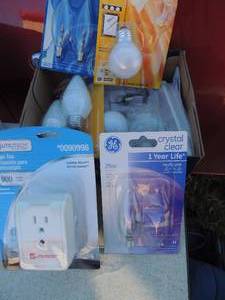 lot 186 image: Light bulbs and surge protector