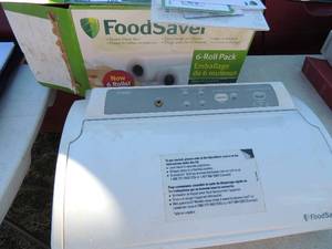 lot 195 image: Food saver machine model V2480 has instructions, bags and roll
