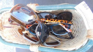 lot 198 image: Wicker basket with 9 pair of sunglasses