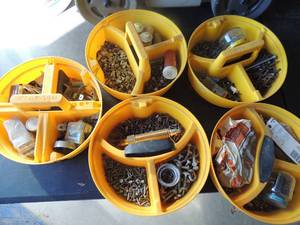 lot 232 image: Tub filled with screws, nuts nails brackets etc.