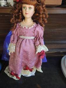 lot 249 image: Porcelain doll on stand The collectors choice