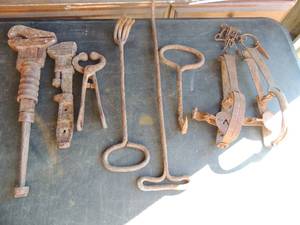 lot 257 image: VINTAGE Pipe wrenches,  metalanimal  traps and hay hooks