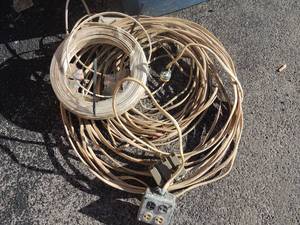 lot 259 image: spool of wire and handmade extension cord has 2 4-way boxes