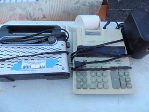 lot 328 image: Radioshack AMFM radio   unisonic XL-1149 adding machine   Boston electrix pencil sharpener
