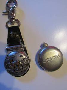 lot 14 image: POCKET WATCH  Lot of 2  - DEER ON A LEATHER WATCH FOB, & CHEROKEE WATCH ( HANDS LOOSE)