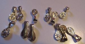lot 258 image: SMALL SILVER NECKLACE CHARMS  58 X 14   QTY 12    TWT. 14 GMS