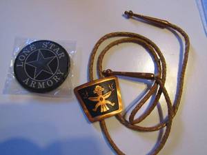 lot 335 image: COPPER BOLO  MEASESURES 1 34 X 1 12  ON LEATHER CORD WITH TIPS