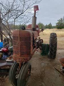 lot 2 image: Vintage Farmall Tractor was running when parked a few years ago. current condition unknown.