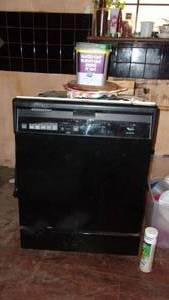 lot 10 image: Whirlpool Dishwasher, Working Condition Unknown But Found Clean Dishes Inside