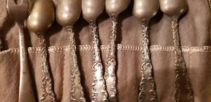 lot 113 image: Sterling Silverware Set, Utensils say Sterling Pat. 1892, Cloth says Georg Jensen Fifth Avenue New York