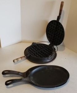lot 173 image: Cast Iron Wagner Waffle Maker, Two Cast Iron Sizzle Servers