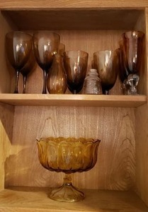lot 89 image: Amber Glass Petal Top Pedestal Bowl and Amber Smoke Colored Stemmed Glasses