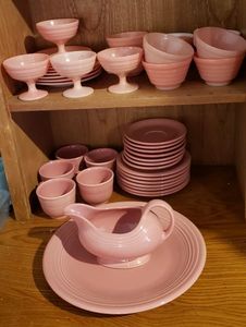 lot 90 image: Salmon Colored Mixed Cups, Plates and Gravy Boat