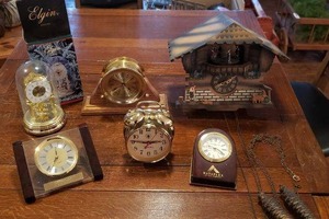 lot 101 image: Small Elgin Dome Clock, Wooden Cuckoo Clock with Moveable Dancers (Condition unknown) and Desk Clocks