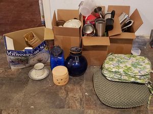 lot 102 image: Country Blessings Dinnerware Set, Blue Glass Cannisters, Chair cushions, Oneida Serving Pitcher, Plastic Cups and Portable Coffee Mugs