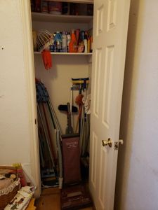 lot 41 image: Cleaning Items Contents of Closet as shown Includes Brooms, Mops, Vacuum